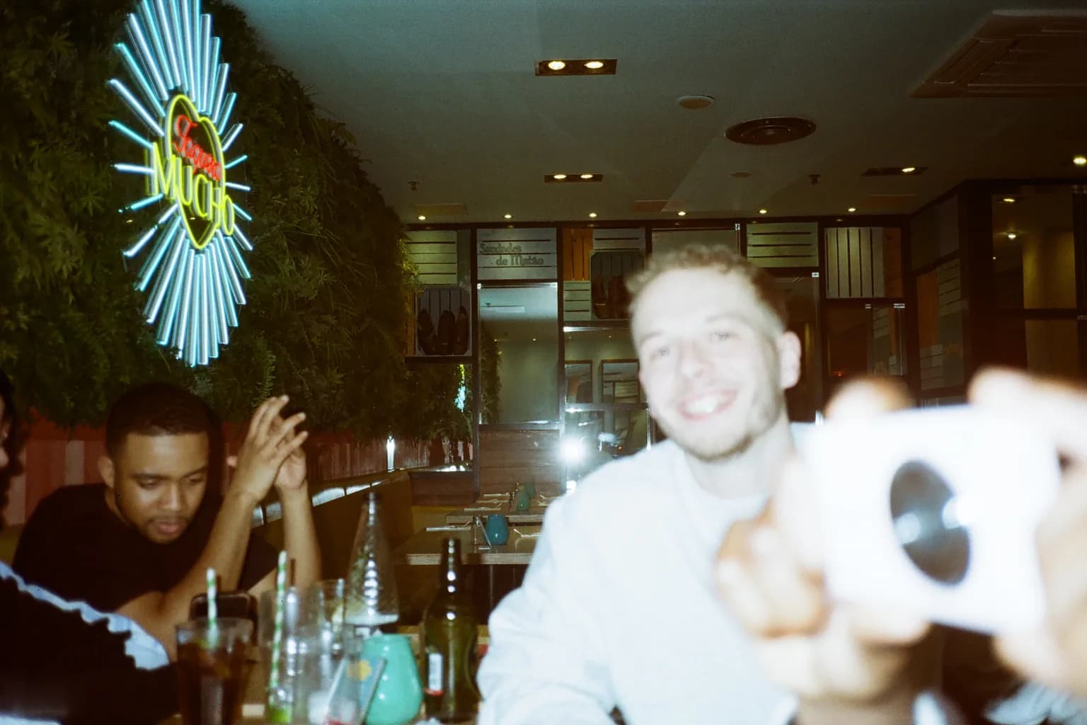 Friends sharing a candid flash-lit party moment