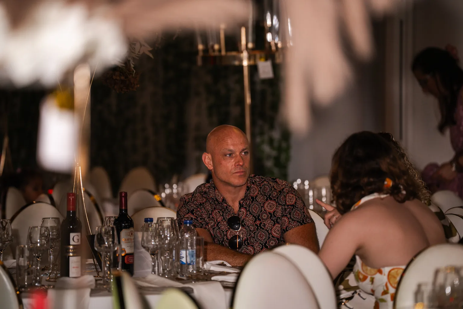 Guests in conversation around a reception table
