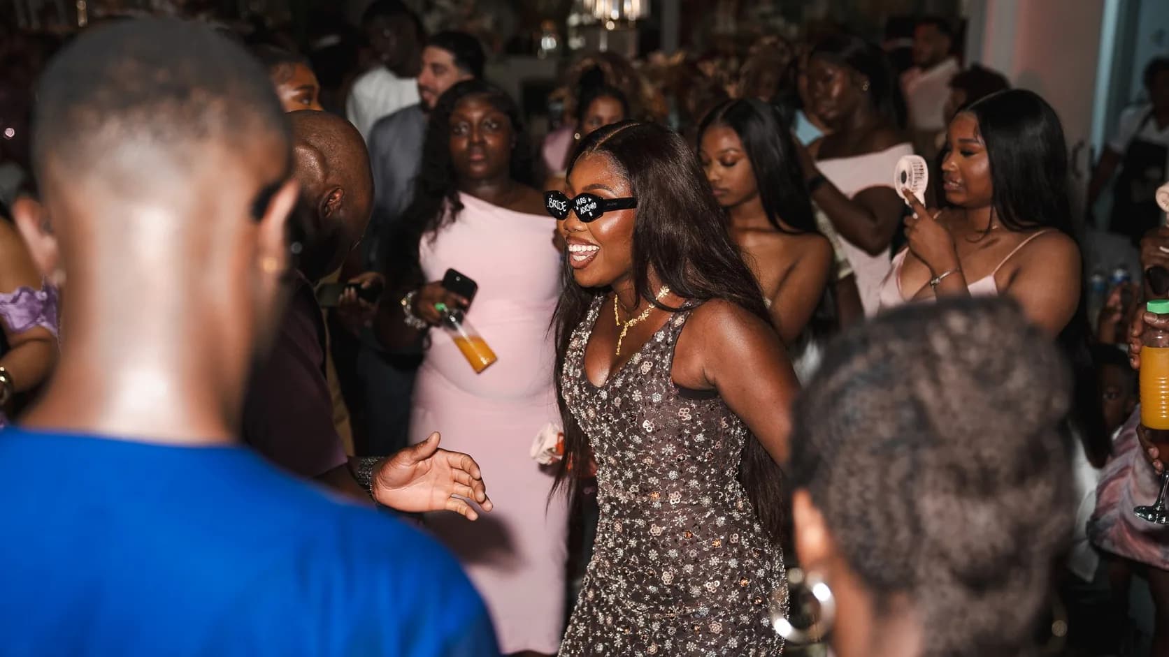 Guests crowding a lively dance floor